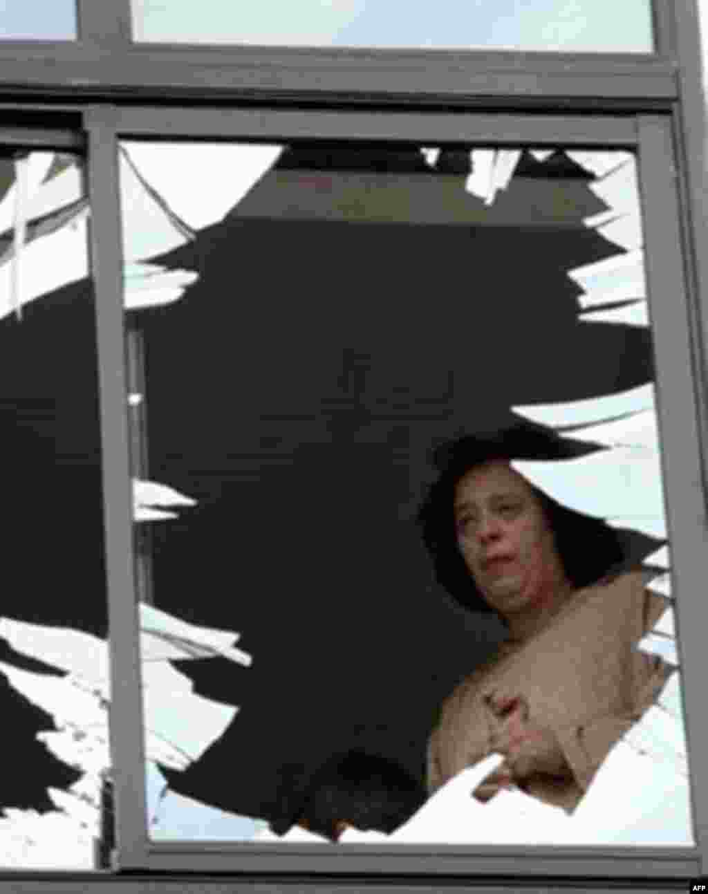 A woman surveys the damage caused by a bomb at a Jewish center in Casablanca, Morocco, on May 17, 2003 (AFP) - At least five bombs exploded simultaneously in Casablanca, Morocco, on May 17, 2003, killing 45 people and injuring scores more. The authorities blame the attacks on Al-Qaeda-affiliated terrorists.