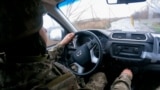 UKRAINE - NEAR POKROVSK - UKRAINIAN SOLDIER DRIVING A CAR - NOVEMBER 2025