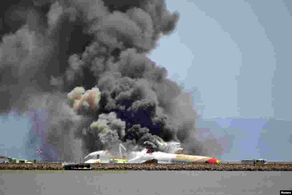 Asiana Airlines Flight 214 burns on the runway at San Francisco International Airport after crash-landing after a flight from Seoul. (Reuters/James O&#39;Malley/Handout via Reuters)