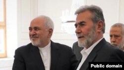 Ziyad al-Nakhalah, the leader of Palestinian Islamic Jihad with Iran's foreign minister Mohammad Javad Zarif. FILE PHOTO