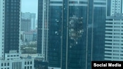 A building is damaged after an apparent drone attack on the Chechen capital, Grozny, on December 5.
