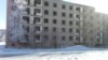 Dozens of five-story apartment blocks have been abandoned in the town of 8,600, and many use improvised stoves to heat their apartments.