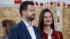 Jakov Milatovic and his wife, Milena, at a polling station during the first round of the presidential election in Podgorica on March 19.
