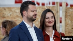 Jakov Milatovic and his wife, Milena, at a polling station during the first round of the presidential election in Podgorica on March 19.
