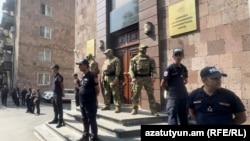 Armenia - Law-enforcement officers guard the entrance to the Anti-Corruption Committee headquarters in Yerevan, August 25, 2026.