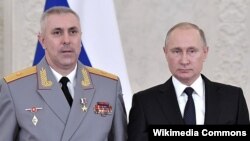 Рустам Мурадов (слева) и Владимир Путин, архивное фото
