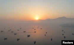 A drone view shows vessels in the Strait of Hormuz, as seen from Musandam, Oman, on June 15.