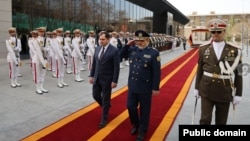 Iran - Iranian Defense Minister Aziz Nasirzadeh greets his Armenian counterpart Suren Papikian at a ceremony in Tehran, February 24, 2026.