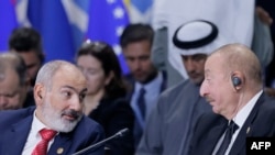 Azerbaijan's President Ilham Aliyev and Armenia's Prime Minister Nikol Pashinyan attend a plenary session in the outreach/BRICS Plus format at the BRICS summit in Kazan on October 24, 2024. (Photo by Maxim Shemetov / POOL / AFP)