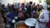 A man distributes free food during the holy fasting month of Ramadan in Jalalabad on May 7.