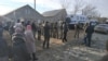 Their homes and the houses of their relatives in the central town of Oktyabrske were also searched.