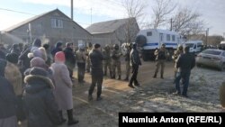 Their homes and the houses of their relatives in the central town of Oktyabrske were also searched.