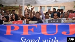 Journalists from The Pakistan Federal Union of Journalists (PFUJ) shout slogans during a demonstration in support of English daily newspaper Dawn in Islamabad in May.