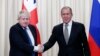 Британия ташқи ишлар вазири Борис Жонсон (чапда) Россия ташқи ишлар вазири Сергей Лавров билан. Москва, 22 декабрь.