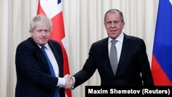 British Foreign Secretary Boris Johnson (left) and his Russian counterpart, Sergei Lavrov, held talks in Moscow on December 22.