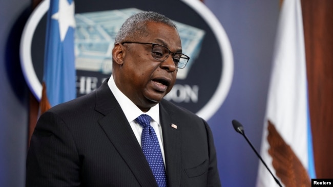 U.S. Defense Secretary Lloyd Austin talks to reporters in Washington on January 28.