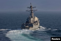 The USS Frank E. Petersen Jr. missile destroyer sails in the Arabian Sea on March 18. This class of ship could be an important part of blockade enforcement.