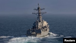 The USS Frank E. Petersen Jr. missile destroyer sails in the Arabian Sea on March 18. This class of ship could be an important part of blockade enforcement.