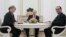German Chancellor Angela Merkel (left to right), Russian President Vladimir Putin, and French President Francois Hollande are pictured during a meeting in the Kremlin, in Moscow, on February 6.