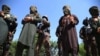 Afghan security officials escort a group of suspected militants who are accused of planning attacks on government and security forces, after their arrest in Jalalabad, April 10, 2019