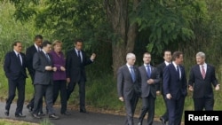 The leaked cables offer unvarnished views on some of the world's most powerful leaders (seen here at a G8 meeting in Ontario, Canada, in June). 