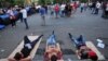 Armenia -- Demonstrators lie on Marshal Bagramian Avenue during a protest against an increase of electricity prices in Yerevan, June 24, 2015