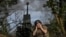Ukrainian servicemen fire a self-propelled howitzer toward Russian positions on a frontline in the Zaporizhzhya region
