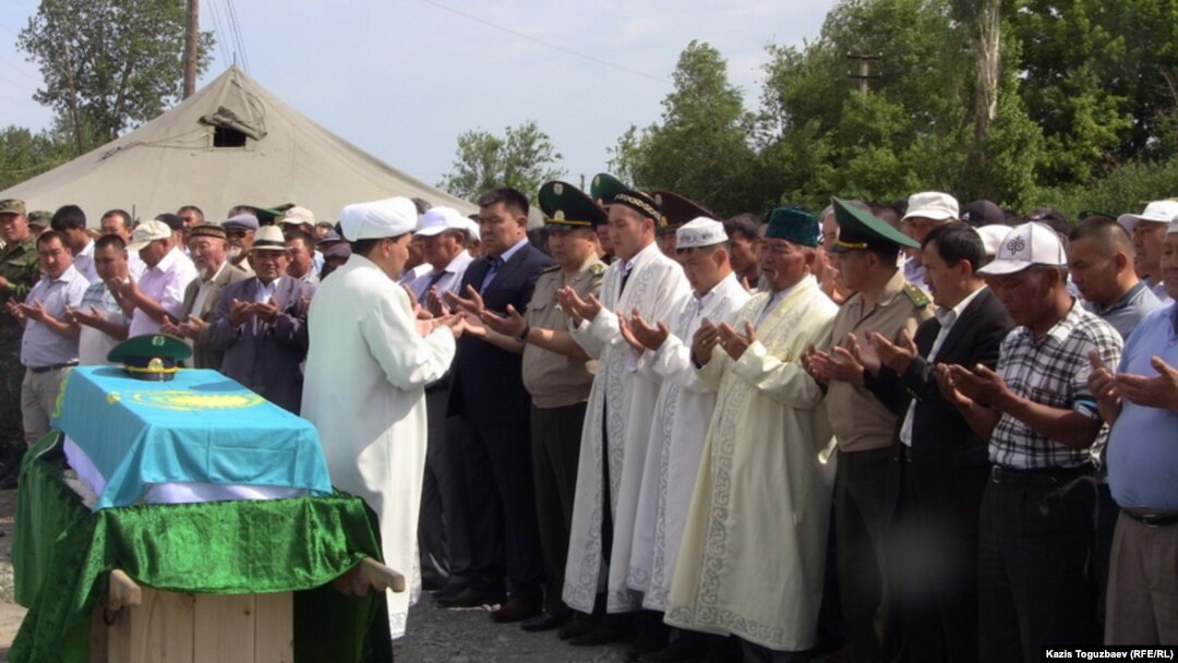 A memorial service in June 2012 for one of the 14 border guards who died in the late-May killings on the Kazakh-Chinese border.