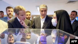 The head of the International Atomic Energy Agency, Rafael Grossi (left), visits the headquarters of Iran's Atomic Energy Organization in Tehran in April. 