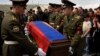 Armenia -- Armenian soldiers carry the flag-wrapped coffin of one of their comrades killed in Nagorno-Karabakh during the soldier's funeral ceremony at the Yerablur military cemetery on the outskirts of Yerevan, April 13, 2016