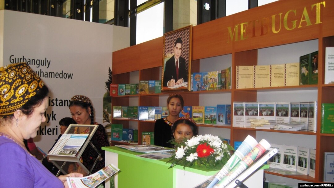 A portrait of the Turkmen president looms over attendees of the international book fair in the capital, Ashgabat.