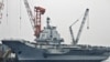 China Tips Hand On Aircraft Carrier