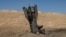 Part of a missile protrudes from the ground, from the ground, following strikes from Iran, in the central Israeli-occupied West Bank