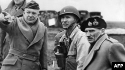 France -- Supreme Commander of the Allied Forces, General Dwight D. Eisenhower shows the strain of his command as he and Britain's Field Marshal Bernard Montgomery, his deputy commander, confer on the invasion plans of Normandy, 06Jun1944