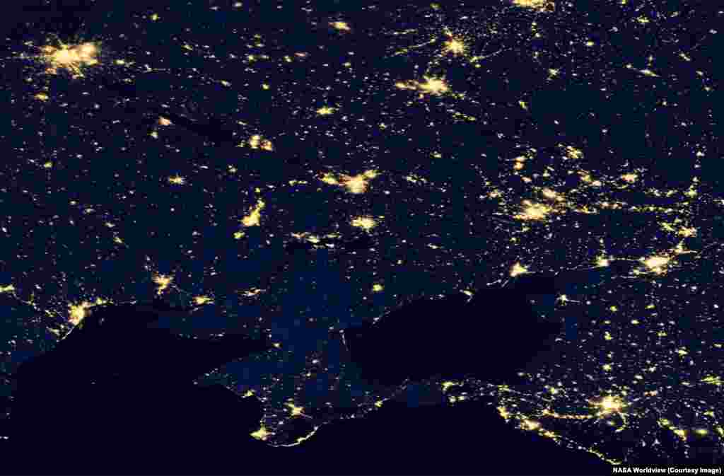 Nighttime views of southeastern Ukraine and western Russia seen on June 14, 2012 and April 27, 2026.Today swathes of Ukraine's once bustling Donbas region are plunged into darkness after sunset due to a combination of wartime power outages and depopulation. The Donbas region has seen millions of its residents flee conflict there since 2014.