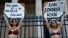 Women in Paris express solidarity with an Iranian woman who was arrested outside her Tehran university.