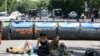 Armenia - Protesters sit and lie on the ground behind a barricade built on Marshal Bagramian Avenue, Yerevan, 29Jun2015.