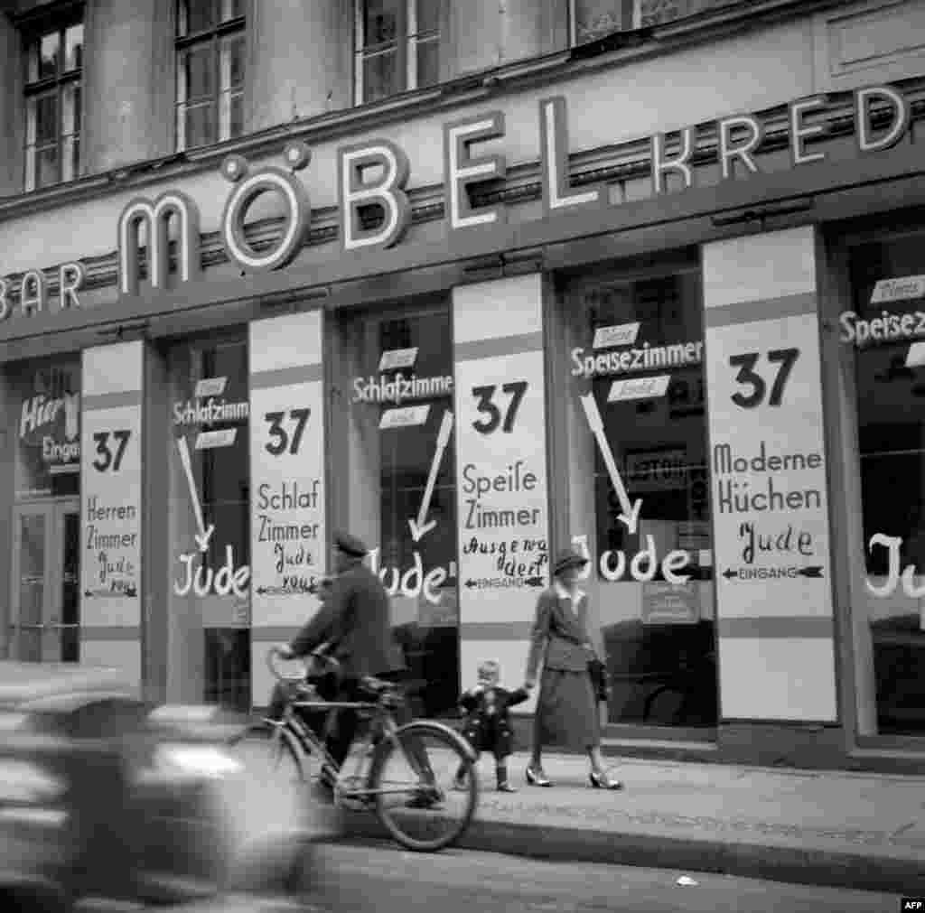 A Jewish-run shop in Berlin with the word &quot;Jude&quot; or &quot;Jew&quot; painted on its windows, November 10,1938.