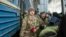 Relatives and friends meet returning Ukrainian soldiers in Lviv on February 23. 