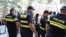 Полиция наблюдает за акцией протеста у здания парламента Грузии. Тбилиси, сентябрь 2019 года