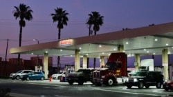 Drivers fill their tanks at a Costco gas station in Commerce, California.