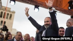 Armenian opposition leader Nikol Pashinian waves to supporters after being elected as prime minister in Yerevan's Republic Square on May 8, 2018.