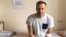 A handout image made available on the official website of Aleksei Navalny shows the opposition leader sitting on a hospital bed in Moscow on July 29.