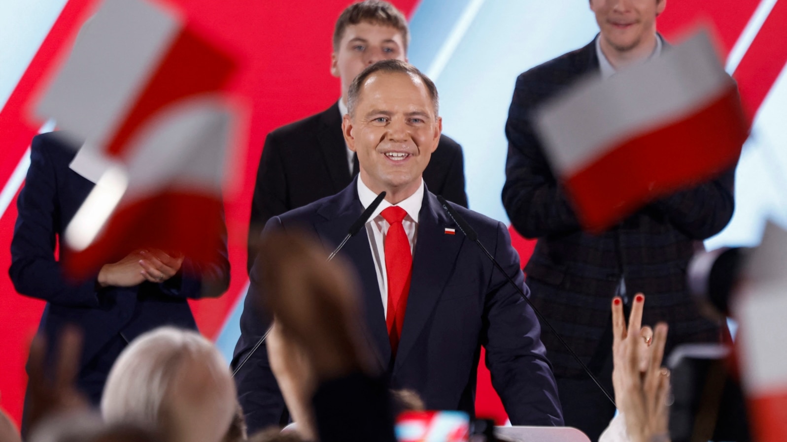 Karol Nawrocki, candidate for the 2025 Polish presidential election supported by Poland's right-wing Law and Justice (PiS) party, addresses supporters as exit polls were announced during their election night event at the Mala Warszawa Theatre in Warsaw, P