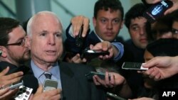 U.S. Senator John McCain (Republican-Arizona) talks to reporters after leaving a closed-door meeting about Syria at the U.S. Capitol on September 4 in Washington, D.C.