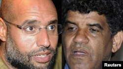 Сын Муамара Каддафи Сейф аль-Ислам и бывший глава разведслужбы Ливии Абдулла аль-Сенусси