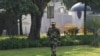 FILE: A Border Security Force (BSF) soldier stands guard outside the Pakistani embassy in New Delhi.