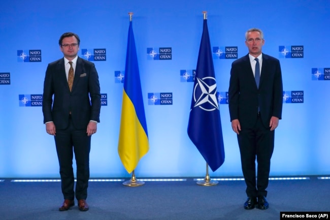 Ukrainian Foreign Minister Dmytro Kuleba (left) and NATO Secretary-General Jens Stoltenberg prior to a meeting at NATO headquarters in Brussels on April 13
