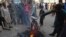 Pakistani protesters burn a poster image of Christian woman Asia Bibi in the southern city of Hyderabad on November 1.