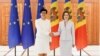 Moldova  President Maia Sandu and EU Commissioner for Enlargement Marta Kos shake hands after a press conference in Chisinau